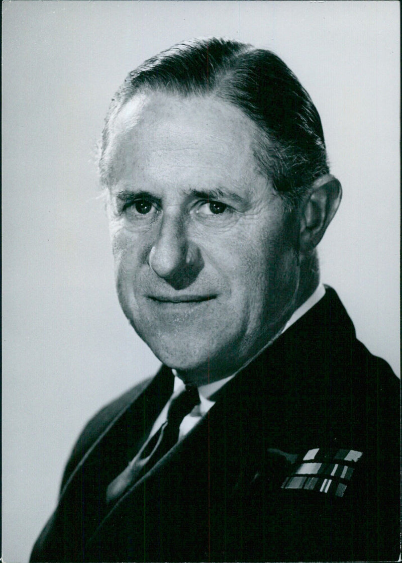 Rear Admiral Charles P.G. Walker, Chief Naval Engineering Officer, poses for a portrait in 1963. - Vintage Photograph