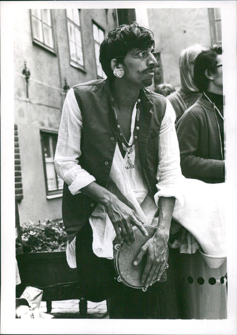 Revelers in traditional costumes parade through Gamla Stan (Old Town) in Stockholm, Sweden on September 1970. - Vintage Photograph