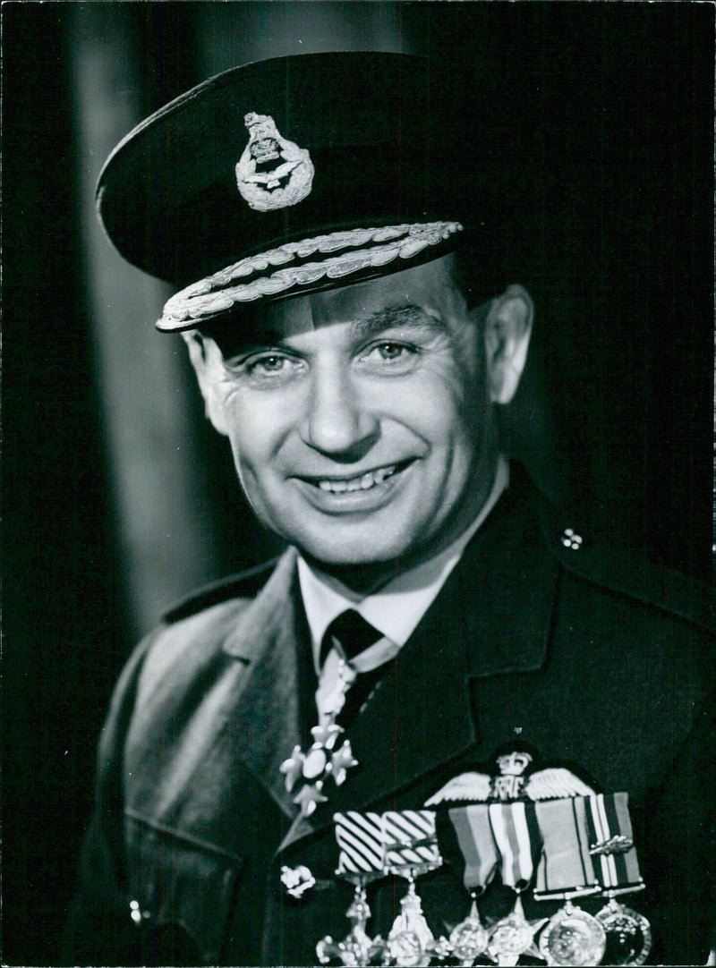 British Service chiefs AIR VICE MARSHAL E.JAMES, C.B.E. and Deputy Controller in the Guided Weapons and Electronics Division of the Ministry of Aviation, pose for a portrait study by photographer WALTER BIRD. - Vintage Photograph