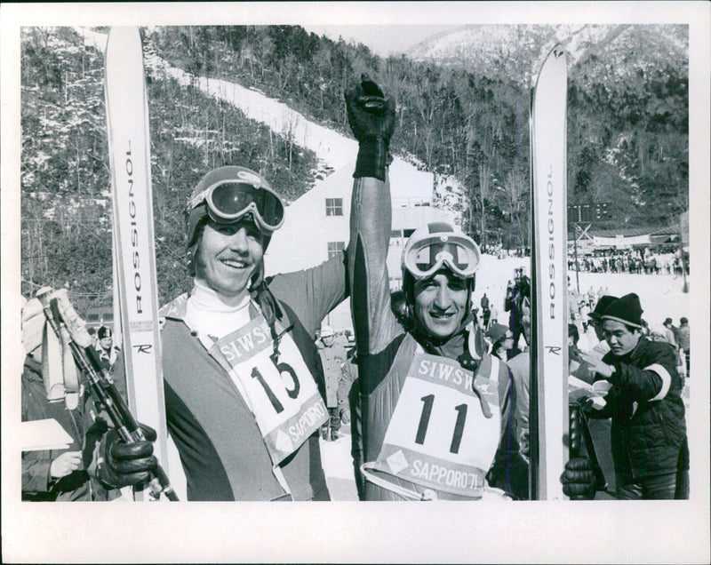 M. Daetwyler of Switzerland and M. Varallo of Italy compete in a men's downhill skiing event at Ost-1555. - Vintage Photograph