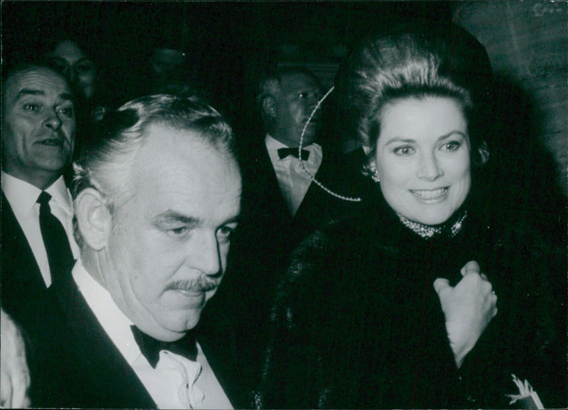 Prince Rainier III of Monaco and Princess Grace, formerly the American film star Grace Kelly, pose for a photograph in 1957. - Vintage Photograph