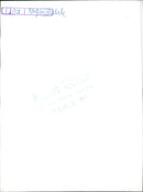 A model poses in a fashion ensemble designed by Rhe Pierre-Charron during a photoshoot in Paris, France. - Vintage Photograph