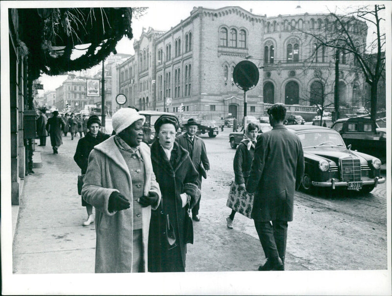 In this December 18th, 1961 photo taken in Torsgat, Sweden, a Bø-retzen is seen in the foreground as Sveffe A looks on. - Vintage Photograph