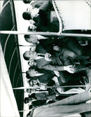 A crowd of people standing in the Salos de Bri M. White Humphung in Barcelona, Spain, on June 21, 1965. - Vintage Photograph