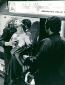 Actress Sylva Koscina on the set of the 1969 film "Assoluto Naturale" (probably "He and She" in English) at the Tirrenia Studios in Fisa, Italy. Photo by Jean & Alan Houghton/Pierluigi Picture Feature Service. - Vintage Photograph