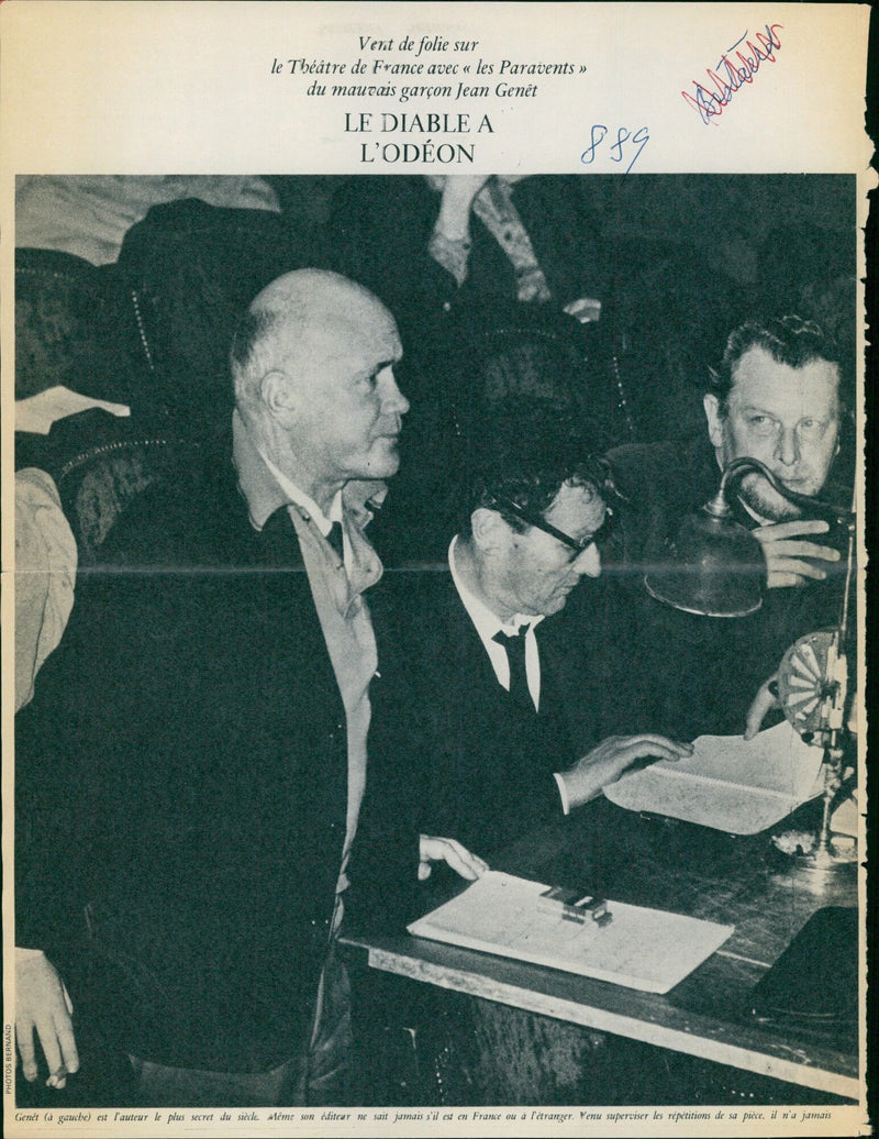 Carlo Ponti and Sophia Loren are seen in a scene from their 1965 film "Les Paravents" at the Theatre de France in Paris. Ponti and Loren, who were married in 1966, had to go through a long legal battle to make their union legal. - Vintage Photograph