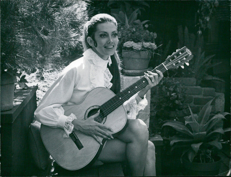 Cayla Hungisatt stars opposite James Garner in the MON Oleage film "The Little Sister", based on Days Bogart's novel. She is photographed in private and on set while shooting scenes with Garner and Rita Morang. - Vintage Photograph