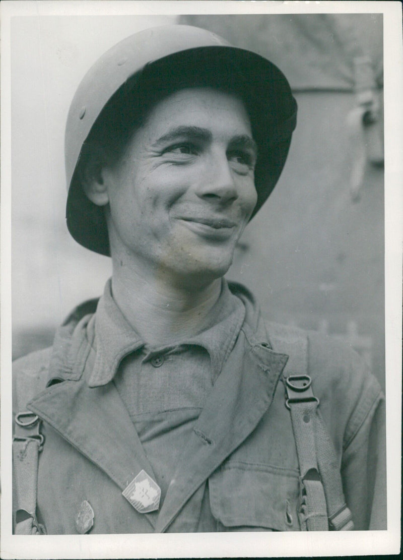 Sergeant Jose Cortes of the Second Armored Division of the French Army stands at an English port, equipped with U.S. material, ready to join the Allied Expeditionary Force in France on August 14, 1944. - Vintage Photograph