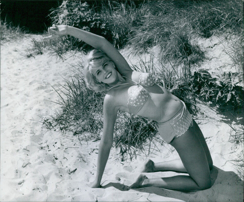 Kirsten Gervin, an international model, is seen with a cheerful smile in Stockholm, Sweden in September 1962. - Vintage Photograph