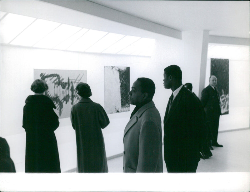 French President Georges Pompidou greets Prime Minister of Cote d'Ivoire Houphouet-Boigny during a state visit in Paris. - Vintage Photograph