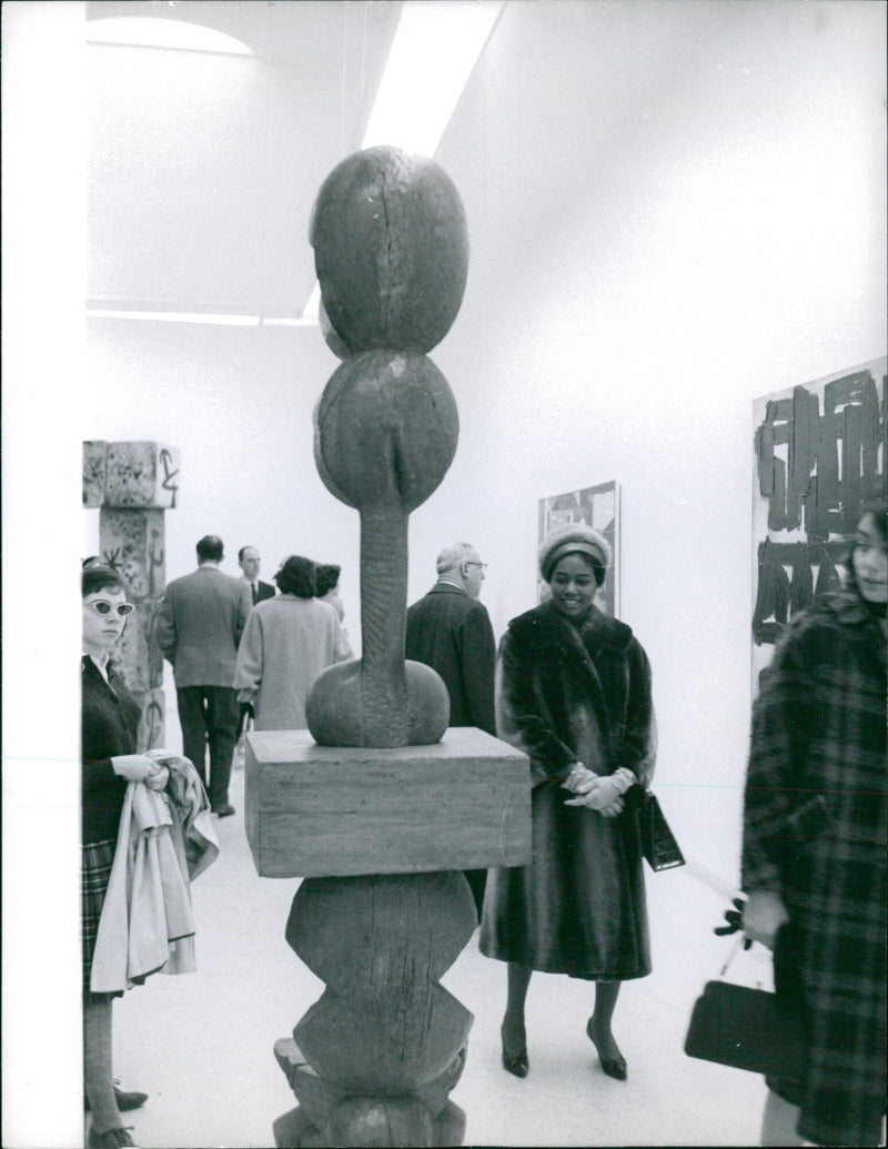 President Félix Houphouët-Boigny of Ivory Coast stands during a ceremony in Stockholm on 24 March, 1951. - Vintage Photograph