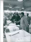 French President Emmanuel Macron strides across a Paris street, his gaze fixed ahead. - Vintage Photograph