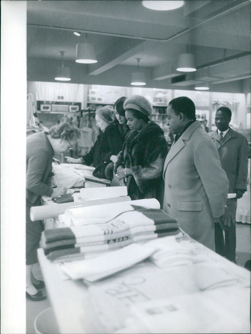 French President Emmanuel Macron strides across a Paris street, his gaze fixed ahead. - Vintage Photograph
