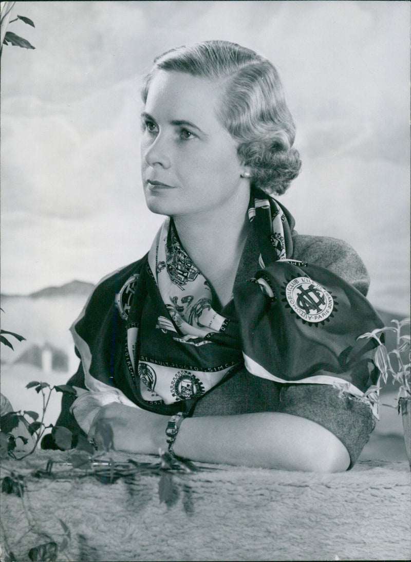 Lady Howe, the 3rd wife of Earl Howe, poses for a portrait study as she promotes a ball in aid of the Royal Life Boat Service in 1952. - Vintage Photograph