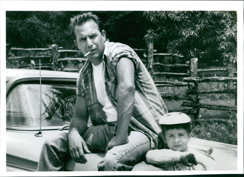 Actors Kevin Costner and T. Lowther feature in the 1993 film "A Perfect World" in this iconic photograph. - Vintage Photograph