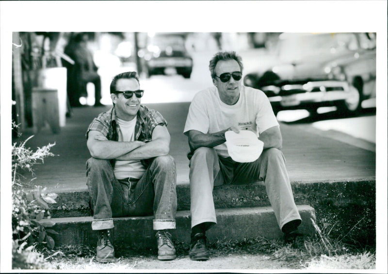 Actors Kevin Costner and Clint Eastwood star in the movie "Erbarmungslos oder "A Perfect World," taken on the set of the film. - Vintage Photograph