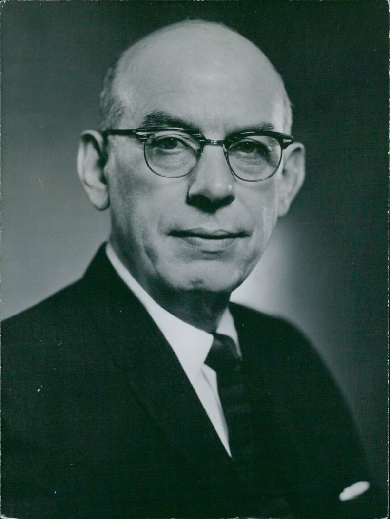 Senator Wallace F. Bennett, a Republican representing the State of Utah, speaks at a press conference in Stockholm, Sweden on September 1, 1959. - Vintage Photograph