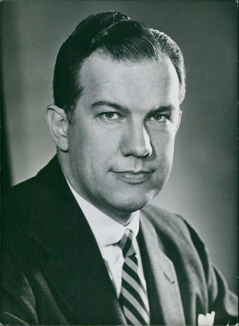 Dr. John T. Rettaliata, President of the Illinois Institute of Technology, poses for a portrait taken by Fabian Bachrach. - Vintage Photograph