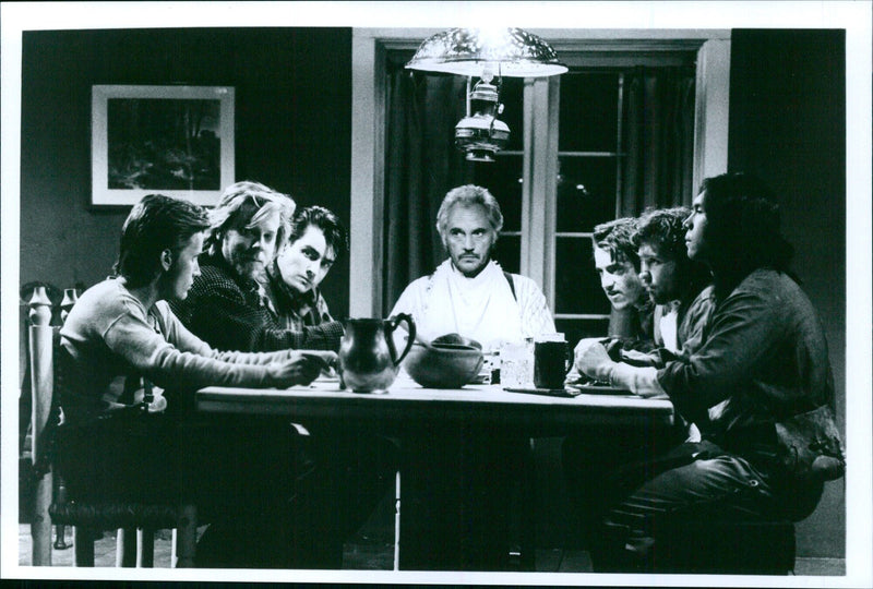 Actors Emilio Estevez, Kiefer Sutherland, Charlie Sheen, Terence Stamp, Dermot Mulroney, Cason Siemaszko, and Lon Diamond Phillips attend the premiere of the 1988 film "Young Guns". - Vintage Photograph