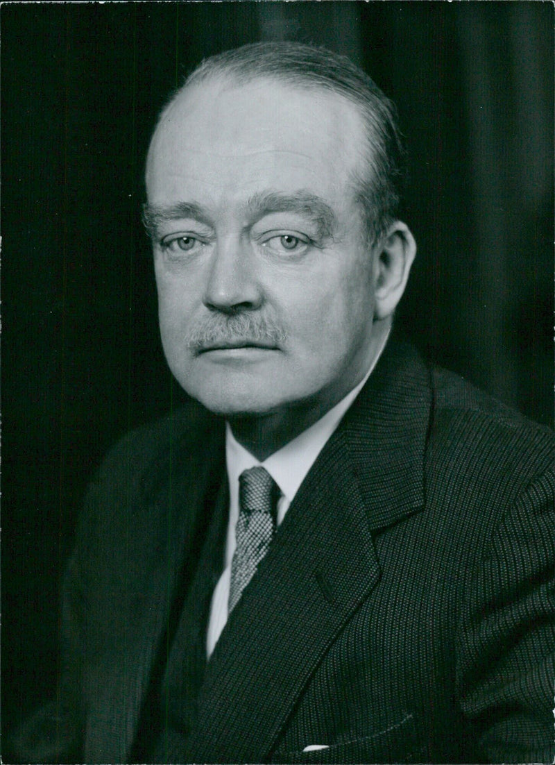 Sir Francis Glyn, K.C.M.G, Chairman of Glyn, Mills & Co and Deputy Chairman of Bank of London and South America Ltd, poses for a photo at Baron Studios in London. - Vintage Photograph