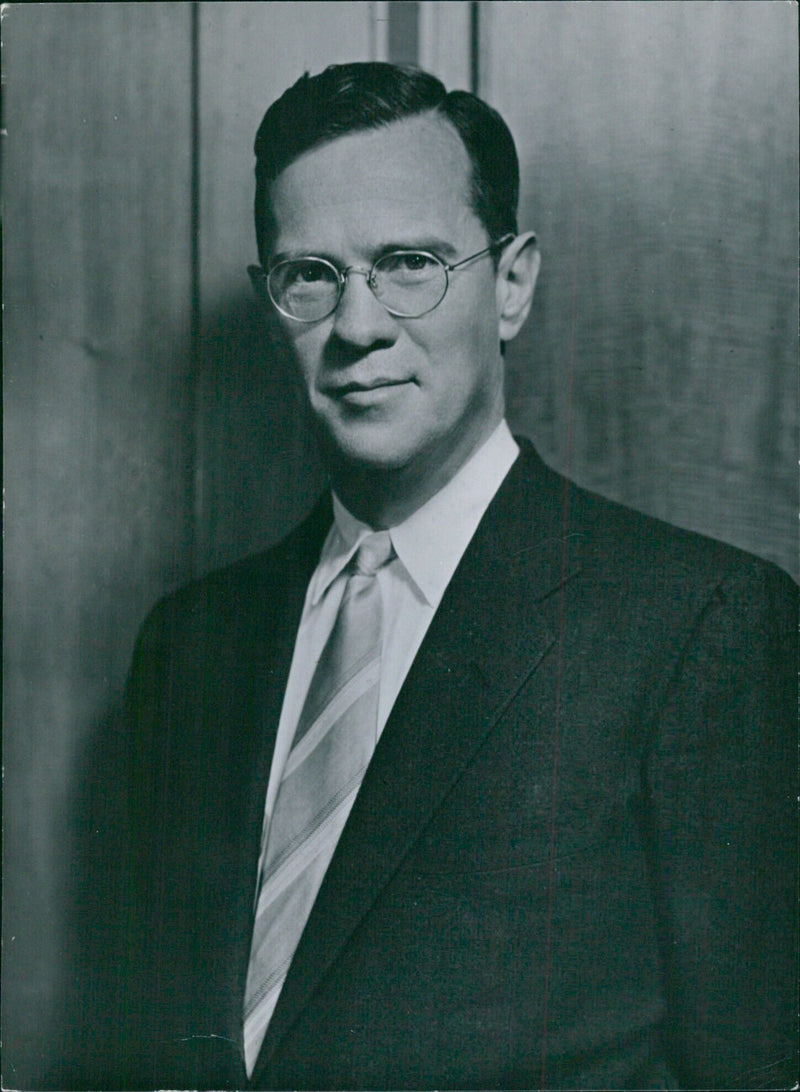 William McChesney Martin, Chairman of the Board of Governors of the Federal Reserve System of the United States, poses for a study by Fablon Bachrach. - Vintage Photograph