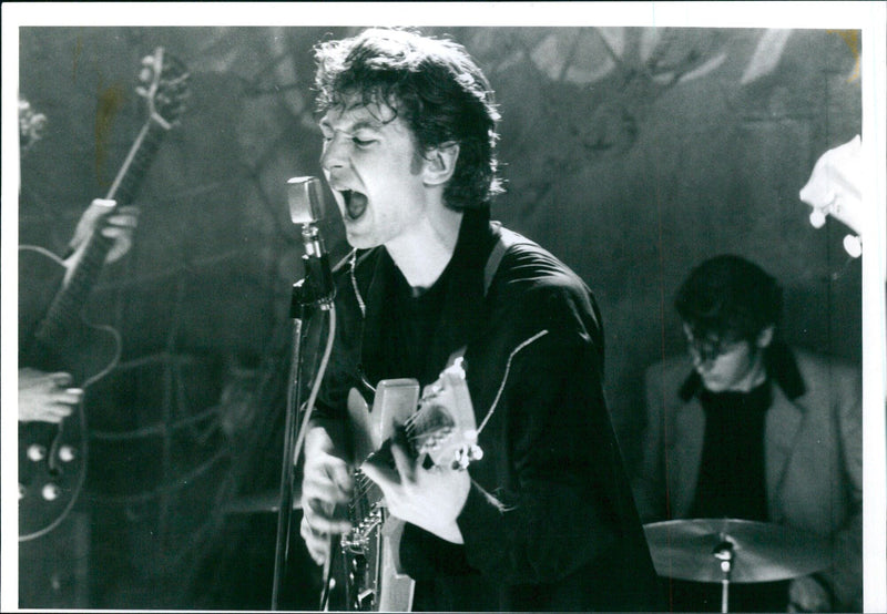 A musician plays a guitar during a rehearsal in Stockholm, Sweden on April 5, 2021. - Vintage Photograph