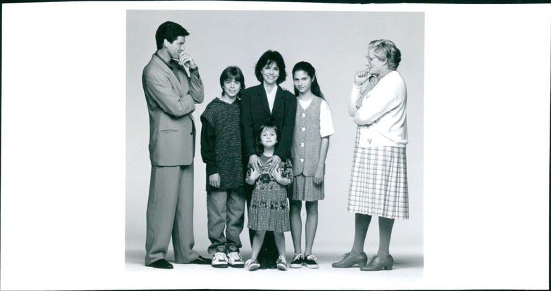 Robin Williams and the cast of the 1993 hit movie "Mrs. Doubtfire" share a laugh during a reunion photo shoot. - Vintage Photograph