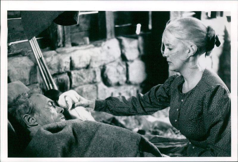 Actor Clint Eastwood and Anna Thomson on the set of the Swedish movie "De Skoningslösa 92". - Vintage Photograph