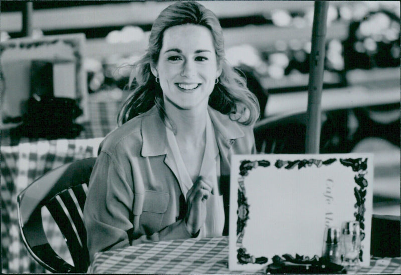 Swedish actress Laura Linney poses for a photo at Cafe Mo Bill while visiting Stockholm. - Vintage Photograph