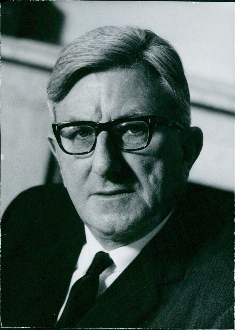 Sir Frank Francis, Director and Principal Librarian of the British Museum since 1959, is pictured in his office. - Vintage Photograph