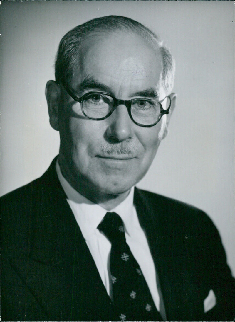 Air Chief Marshal Sir Guy Garrod, M.C. D.F.C., Chairman of Malkay Investments Ltd. and a director of Regis Property Co. Ltd., poses in 1960 for Baron Studios, London. - Vintage Photograph