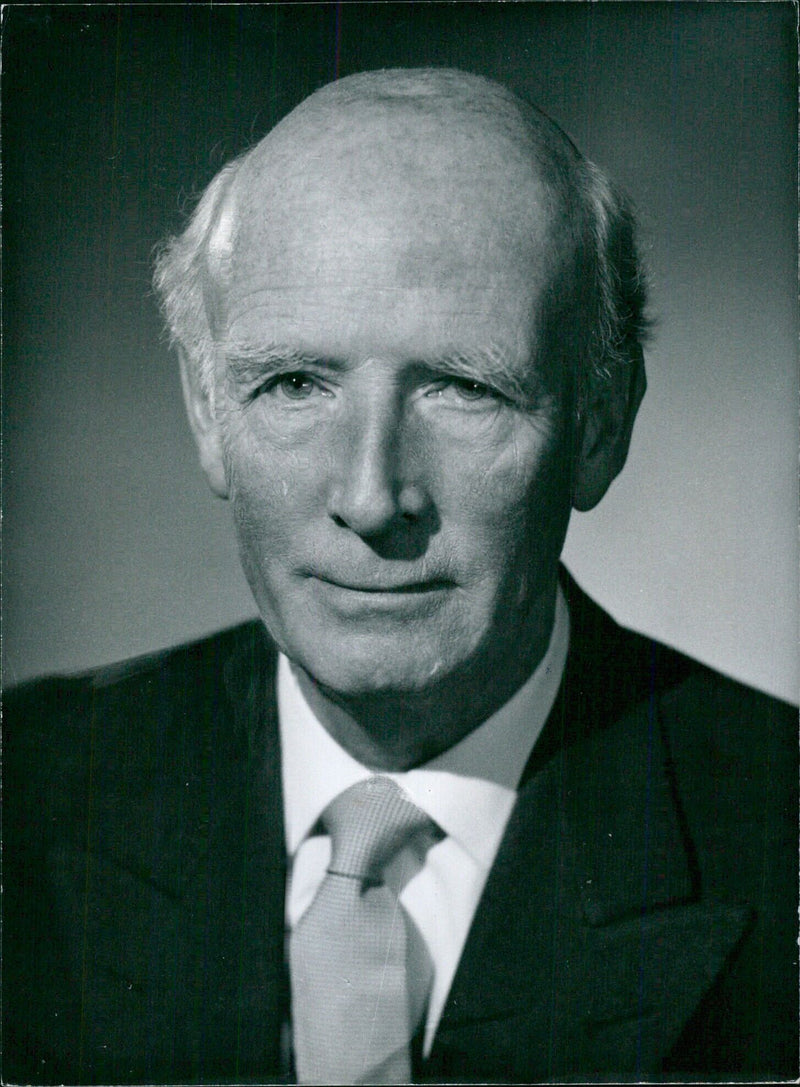 Lord Archibald, Chairman of the Federation of British Film Makers since 1957, poses for a photograph in Russell Court, London. - Vintage Photograph