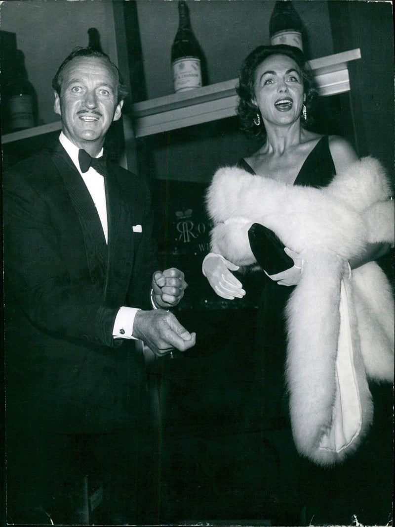 Actor and author David Niven poses with his second wife Hjordis Tersmeden in 1948. - Vintage Photograph