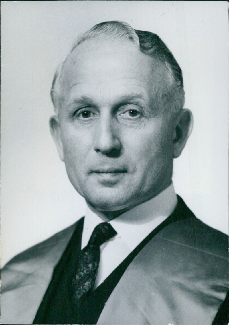 British Personalities: Ronald Raven, consulting surgeon and joint lecturer in surgery at Westminster Medical School, University of London, poses for a portrait study by Bassano. - Vintage Photograph