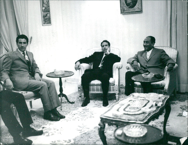 Major Abdel Salam Jalloud, Colonel Moammer al Gadafy, and President Anwar al Sadat of Libya and Egypt respectively, meet in Cairo to discuss strained relations between the two countries. - Vintage Photograph