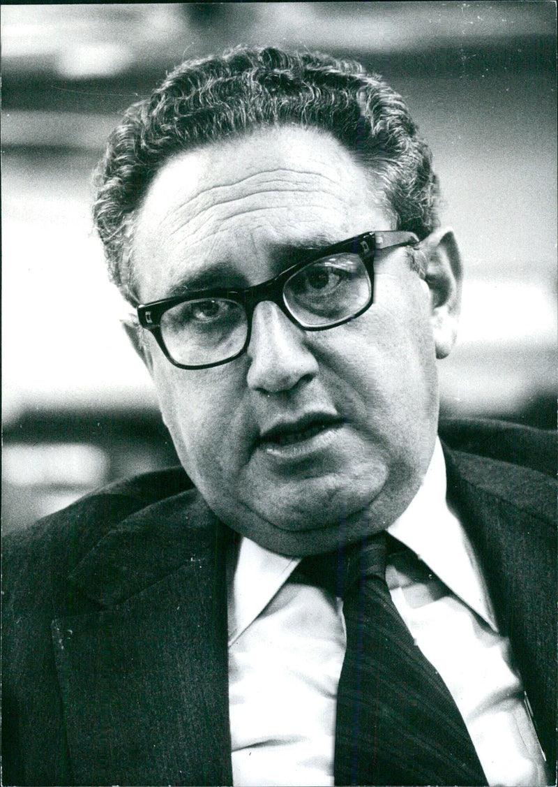 Secretary of State Dr. Henry Kissinger at a press conference in London in 1976. - Vintage Photograph