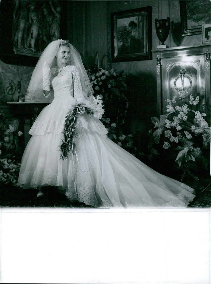 French businesswoman Danièle Richard exchanges rings with her partner at a marriage ceremony in Giron. - Vintage Photograph