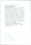 Sam Goldwyn Jr., son of legendary movie mogul Samuel Goldwyn, speaks to the media about his involvement in the British film industry. - Vintage Photograph