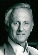 Sam Goldwyn Jr., son of legendary movie mogul Samuel Goldwyn, speaks to the media about his involvement in the British film industry. - Vintage Photograph