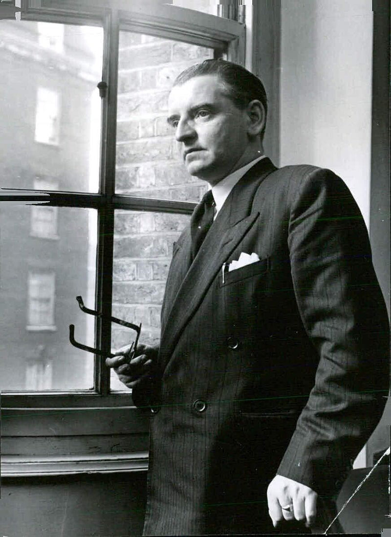 Secretary of the Labour Party, Mr. Morgan Phillips, is pictured at his office in Transport House, London. - Vintage Photograph