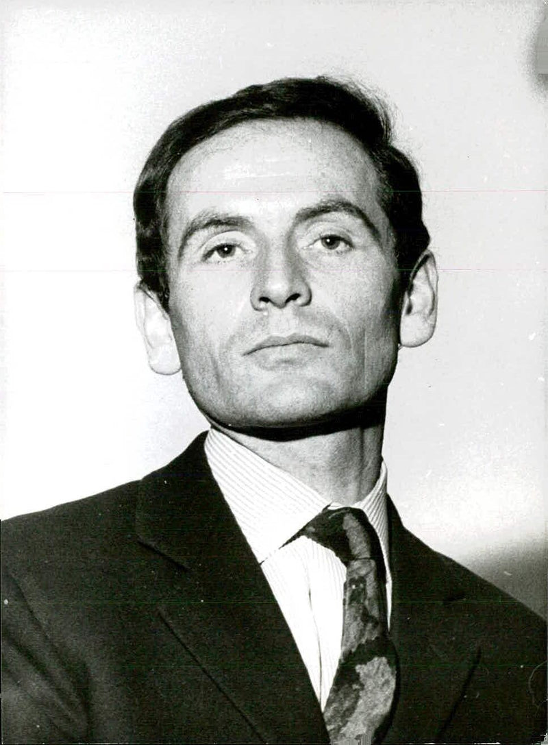 Pierre Cardin, the renowned French couturier, poses in a studio in London for a photoshoot by Tom Blau of Camera Press Ltd. - Vintage Photograph