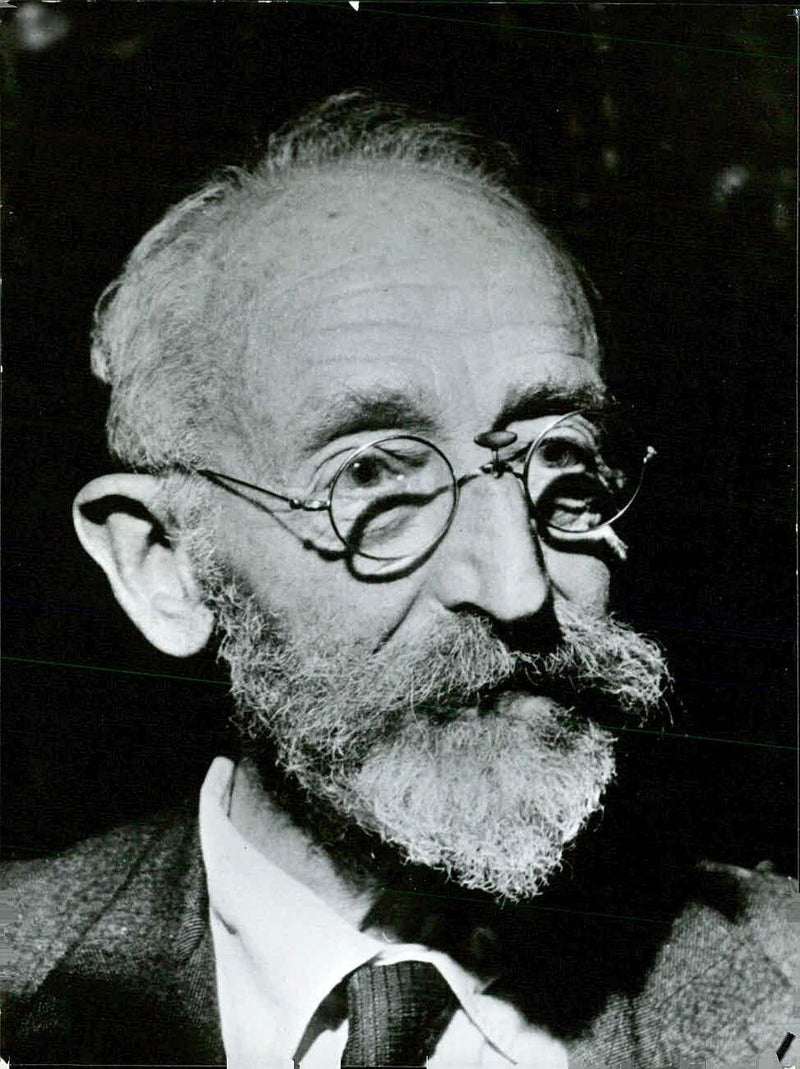 Dr. Neville Samuel Finzi, M.B. M.R.C.S. L.R.C.P., Junior Warden of the Society of Apothecaries and Consulting Radiologist to St. Bartholomew's Hospital in London, poses for a photo taken by Tom Blau. - Vintage Photograph