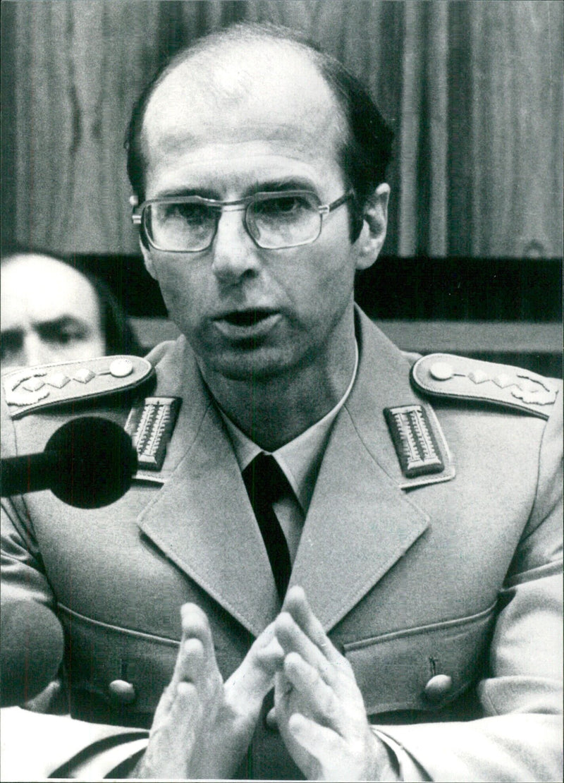 Col. Jurgen Reichardt, producer of the theory that there may have been a double of General Gunter Kiessling, West Germany's highest ranking officer in NATO, at a press conference in 1984. - Vintage Photograph