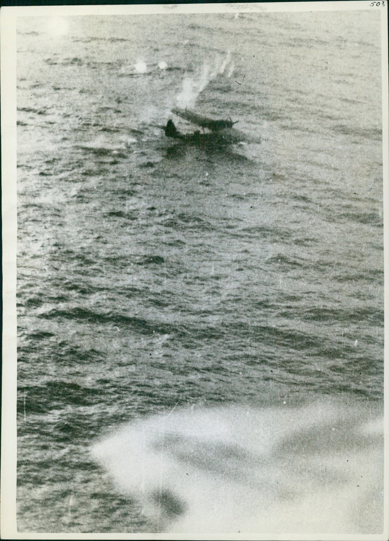 A British Do. 18 flying-boat is forced down on the water by a Hudson aircraft of Coastal Command over England in 1941. - Vintage Photograph