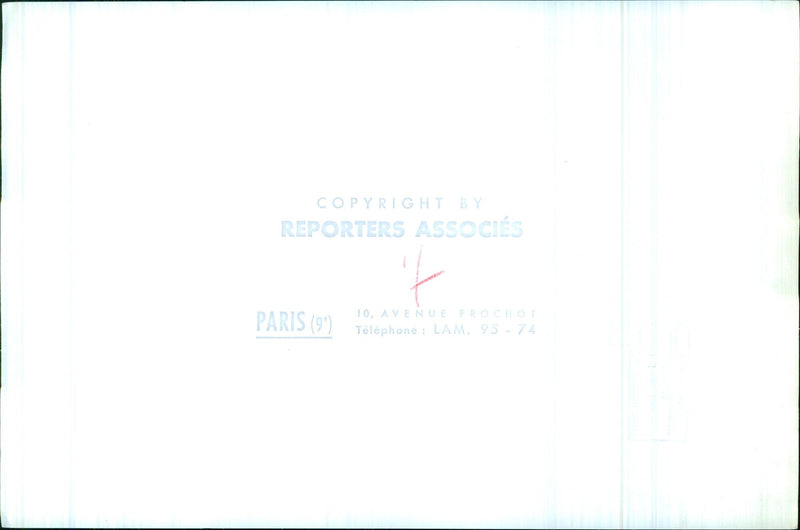 A group of people carrying umbrellas gather around a sign in the Avenue Frochot of Paris, France, on 2021-04-20. - Vintage Photograph