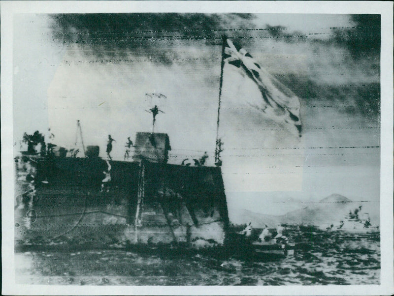 The Duke of York battleship and Mount Fuji are seen in the background as Allied navies gather to witness the Japanese surrender in Sagami Bay. - Vintage Photograph