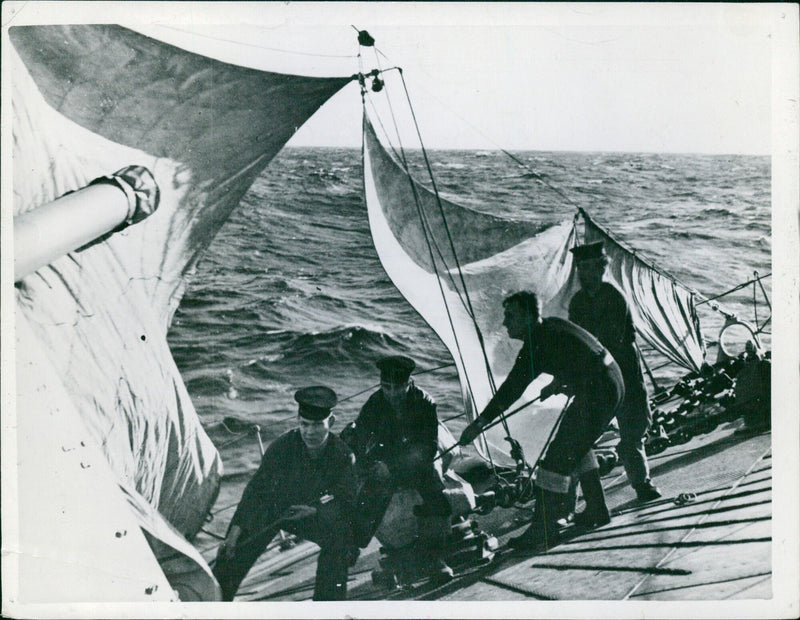 A British destroyer damaged by torpedoes in the Atlantic makes its way home under sail, covering 250 miles in the process, in March 1942. - Vintage Photograph