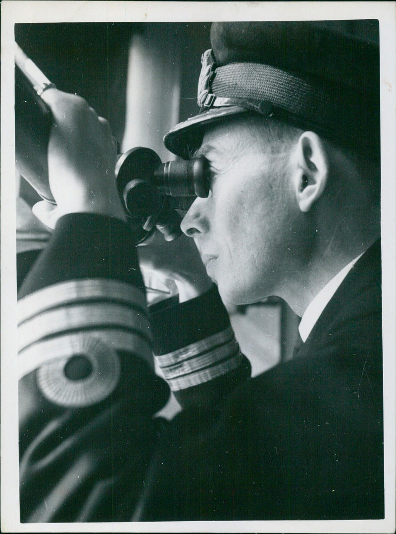 Officers observe a torpedo test launch from an observation room aboard a British Royal Navy vessel in 1940. - Vintage Photograph