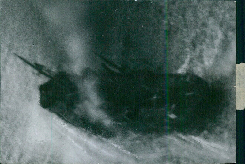 German military aircraft fire on a merchant vessel, as captured by photographer Arthur Grimm, off the coast of Kiel on September 24th, 1941. - Vintage Photograph