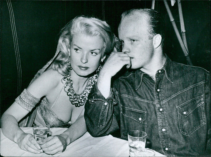 Dennis Crosby, son of crooner Bing Crosby, and his wife Pat Sheehan, a former dancer at the Tropicana Club, Las Vegas, are pictured together after their marriage in May 1958. Mrs. Crosby has a 9-year-old son from a previous marriage. - Vintage Photograph